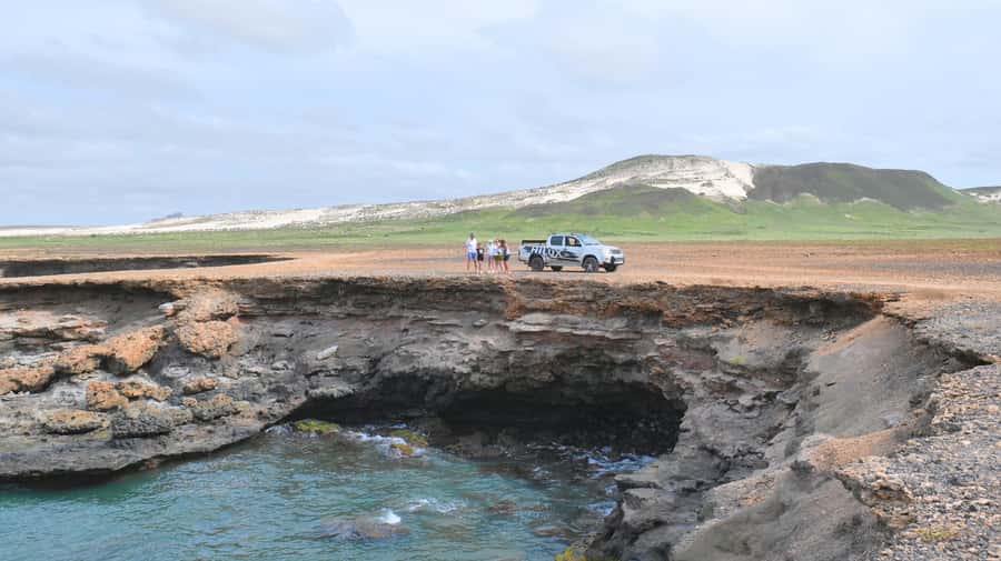 Boa Vista: Shark, Turtles, Cave, Sandboarding & Tasting Tour - Praia Varandinha Caves: Photos, Birds, and That Jagged Coast Feel
